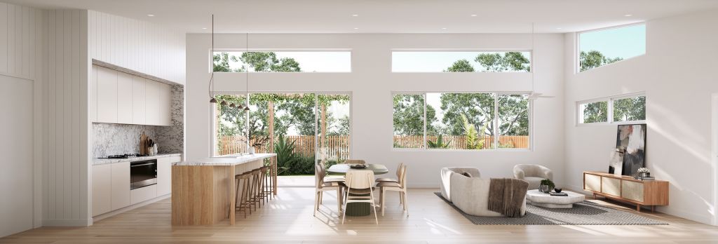 Open-plan kitchen, dining and living area with timber island bench, marble splashback and large windows looking onto landscaped garden