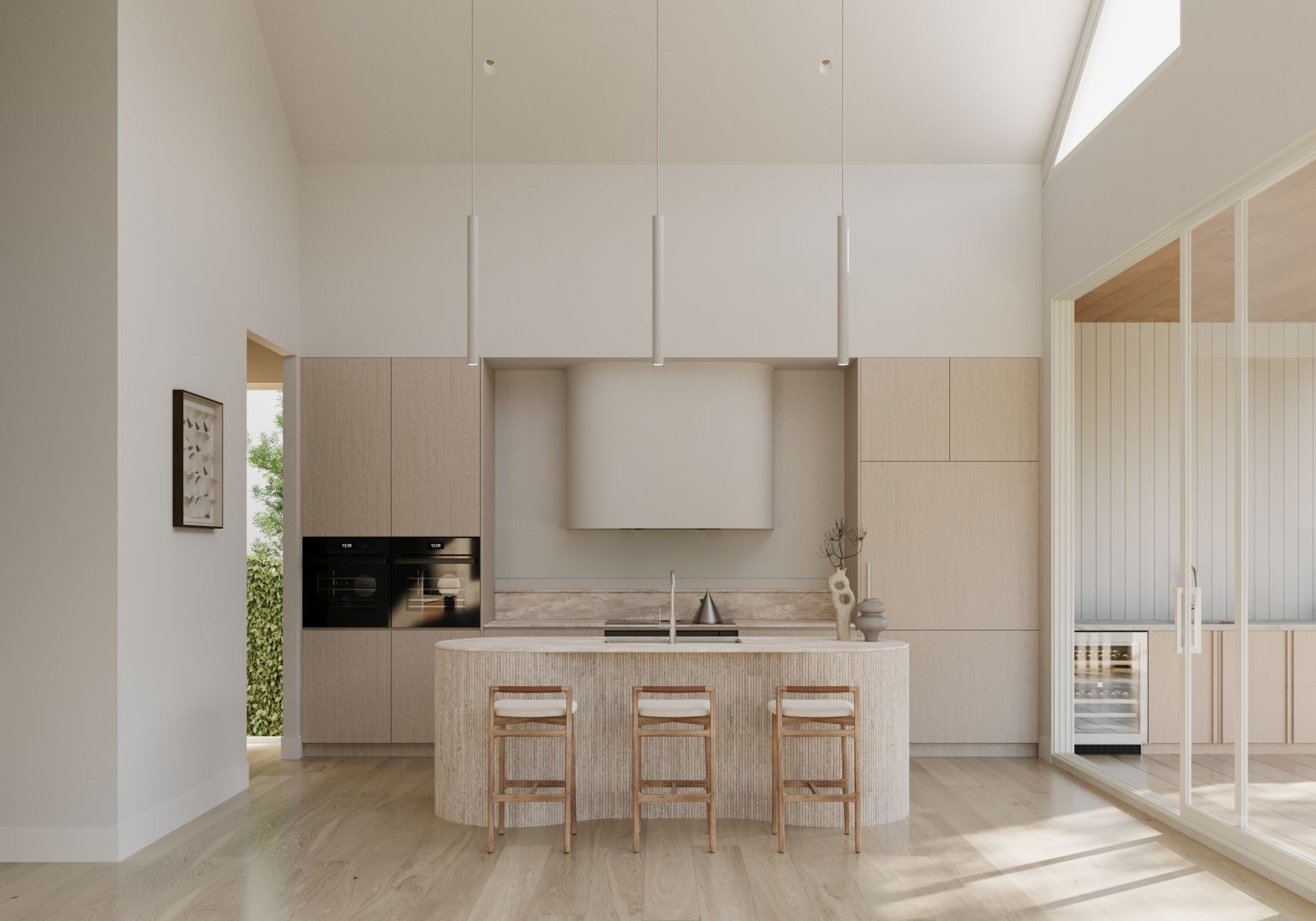 Kitchen with curved travertine island, timber cabinetry, integrated double ovens and pendant lighting