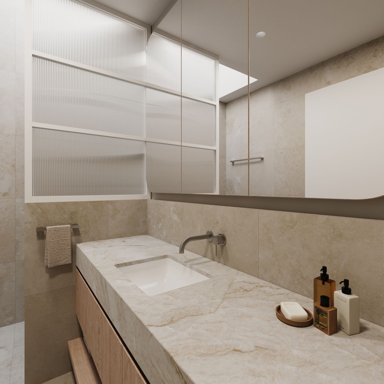Close-up of bathroom vanity with marble benchtop, undermount sink, wall-mounted tapware and mirrored cabinetry