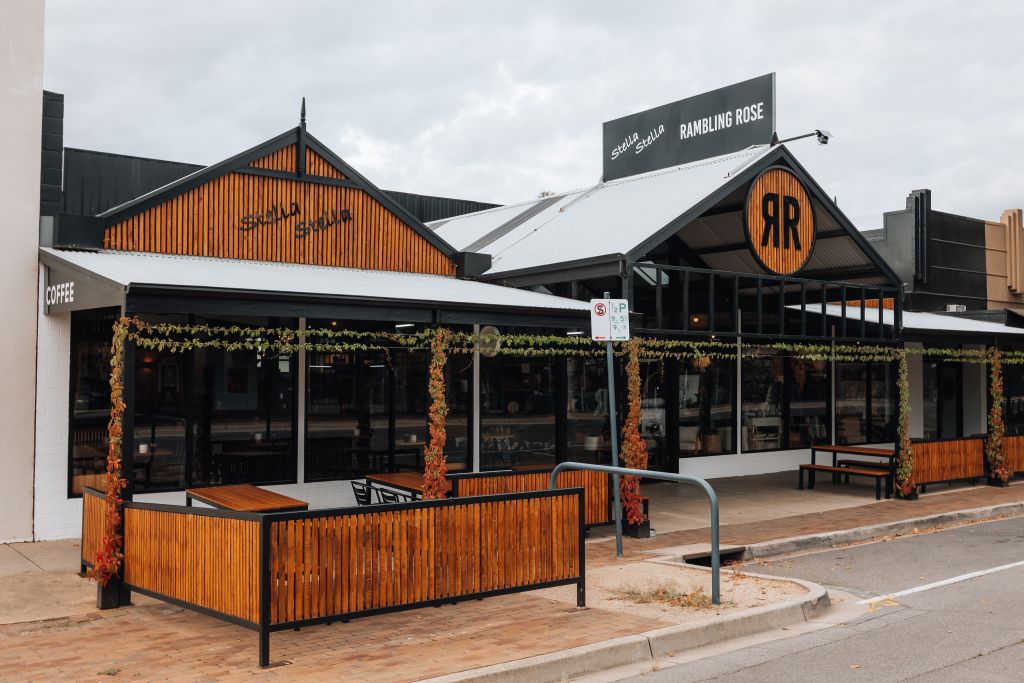 Stella Stella and Rambling Rose café/retail building exterior with timber gable signage and outdoor seating